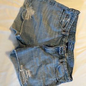 Levi’s 12/31 factory cut off jean short.  Timeless distressed frayed.